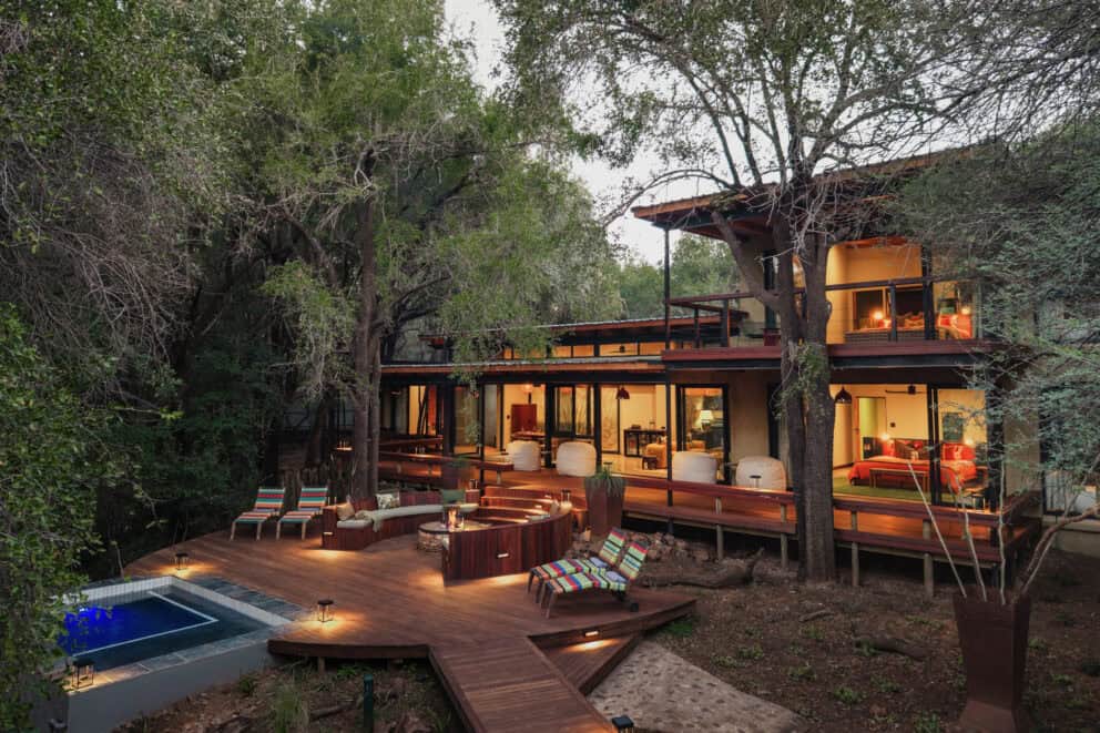 Exterior view of a luxury suite with a private wooden deck, a boma and plunge pool at Jaci's Private Lodge, Madikwe Game Reserve, South Africa.
