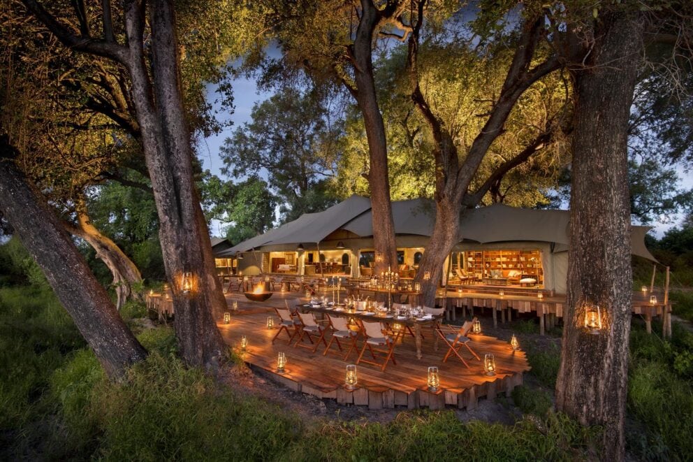 Exterior view at sunset of the main area at Duba Plains Camp, Botswana.
