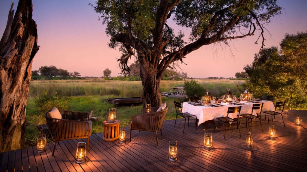 Romantic candlelit dinner in the Okavango Delta. This is perfect for a Botswana honeymoon safari.