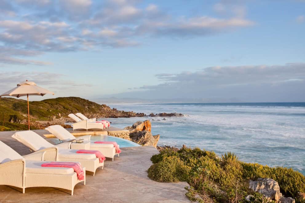 Loungers on the sun deck overlooking the ocean at Birkenhead House Hermanus