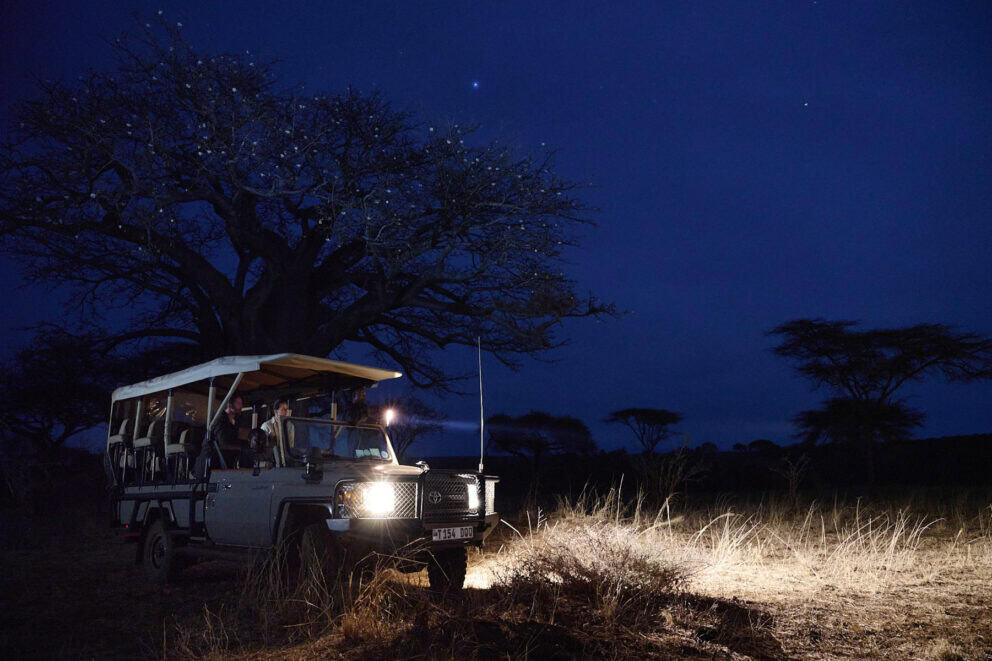 Tourists on a night game drive at Swala Camp, Tanzania.