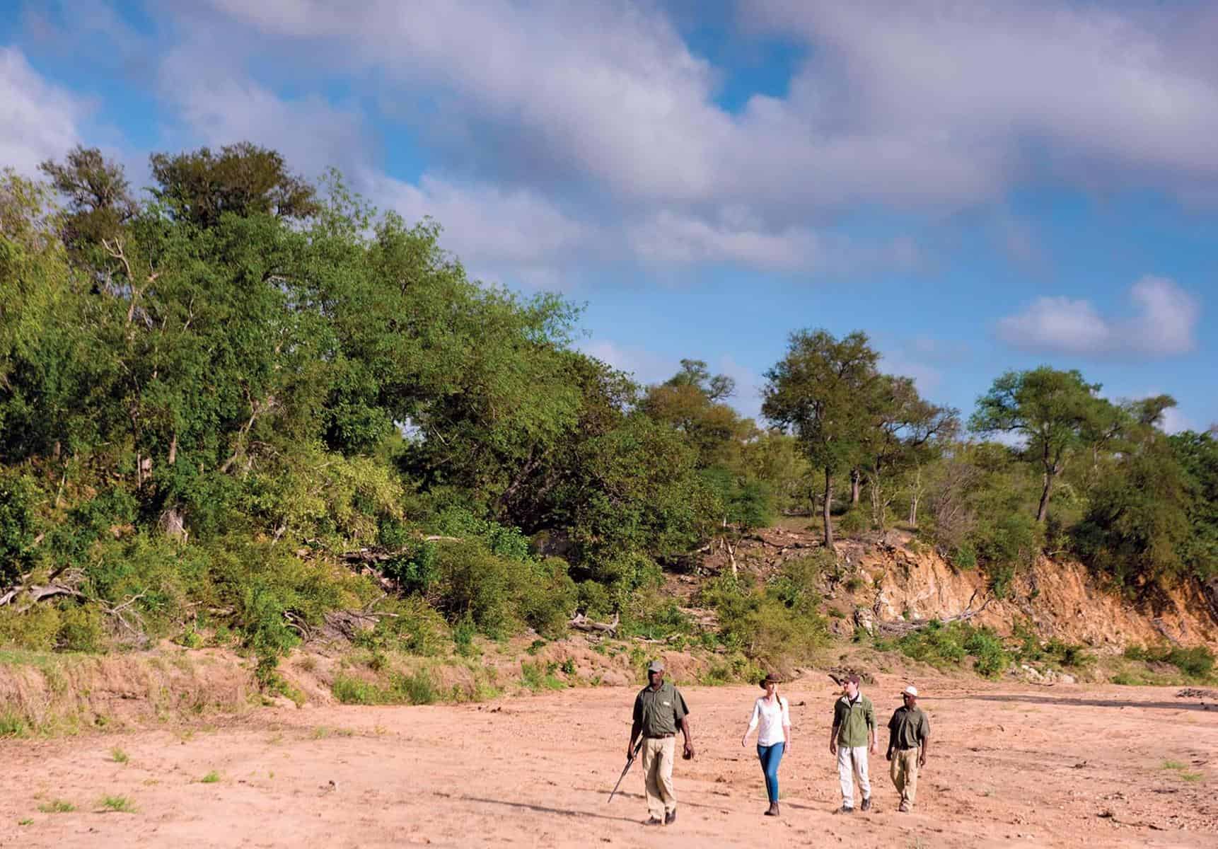 Guests on a guided walking safari near Kings Camp, South Africa.