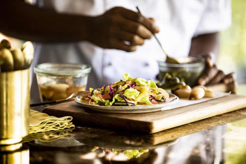 Food being plated at Singita Sweni Lodge, South Africa.