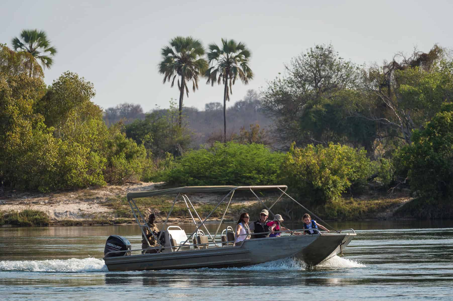 Tourists on a boat cruise on the Zambezi River at Toka Leya, Zambia.