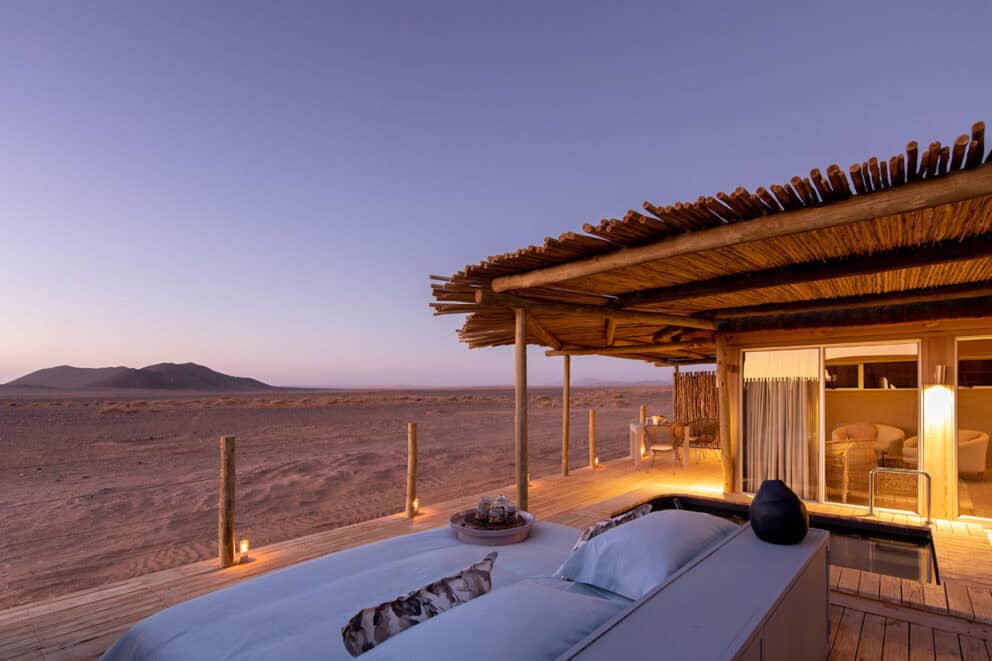 Star bed on a wooden deck at night