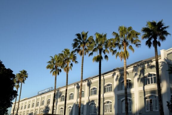 Exterior view of Hotel with palm trees | Photo credit: V&A Hotel