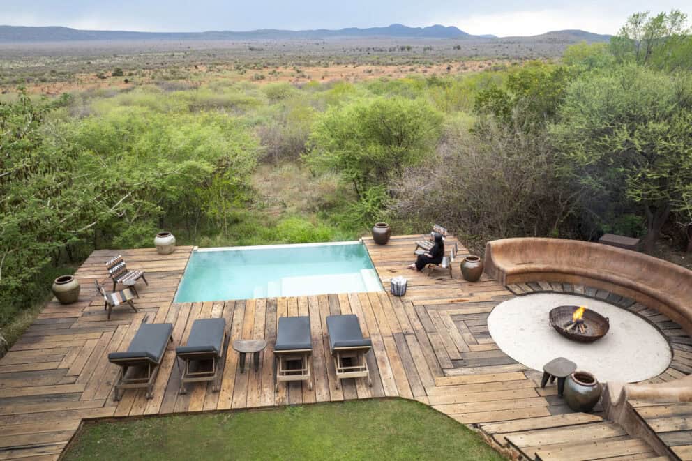 Aerial view of the pool area and boma overlooking the African bush at Dithaba Lodge, Madikwe.