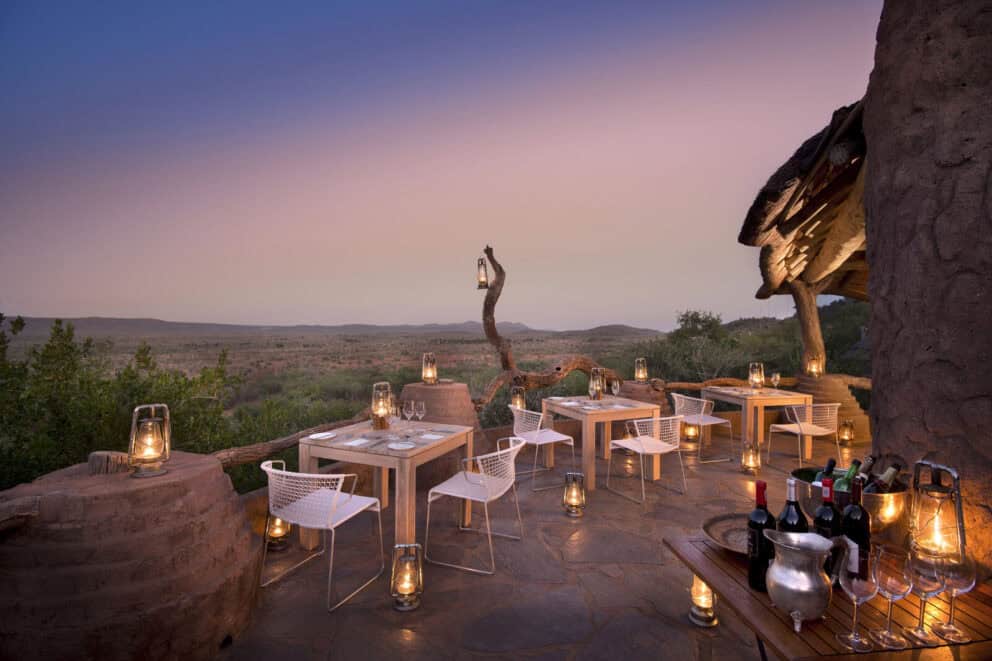 Dining by candle light on the sky deck at Dithaba Lodge, Madikwe.