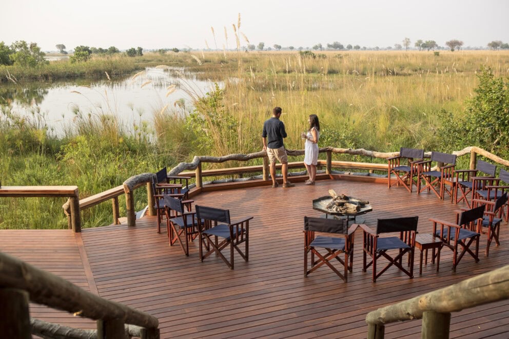 Guests on the deck at Shinde in the Okavango Delta, Botswana | Photo credit: Shinde