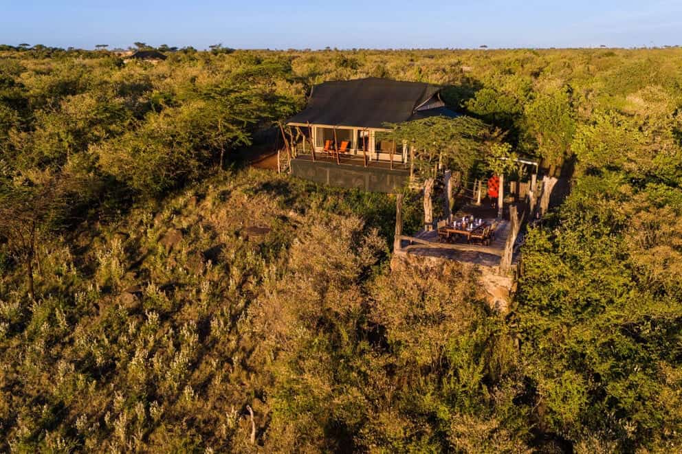 Aerial view of Saruni Eagle View, located atop a natural hilltop in the Mara Naboisho Conservancy, Kenya 