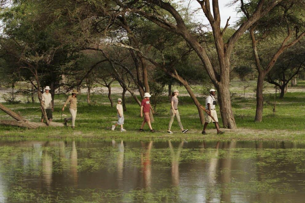 A family on a guided nature walk at Shinde, Botswana.
