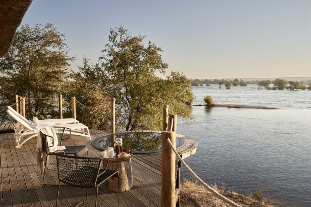A plunge pool and two loungers overlooking the Zambezi River in Zimbabwe