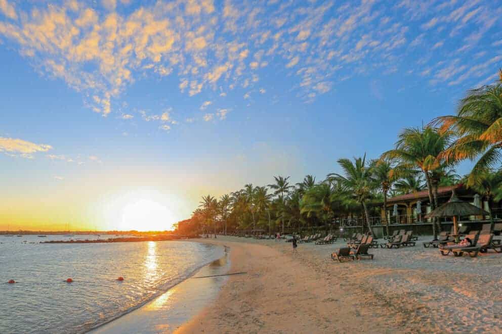 Sunset view of the beach at Mauricia Beachcomber Resort & Spa, Mauritius.