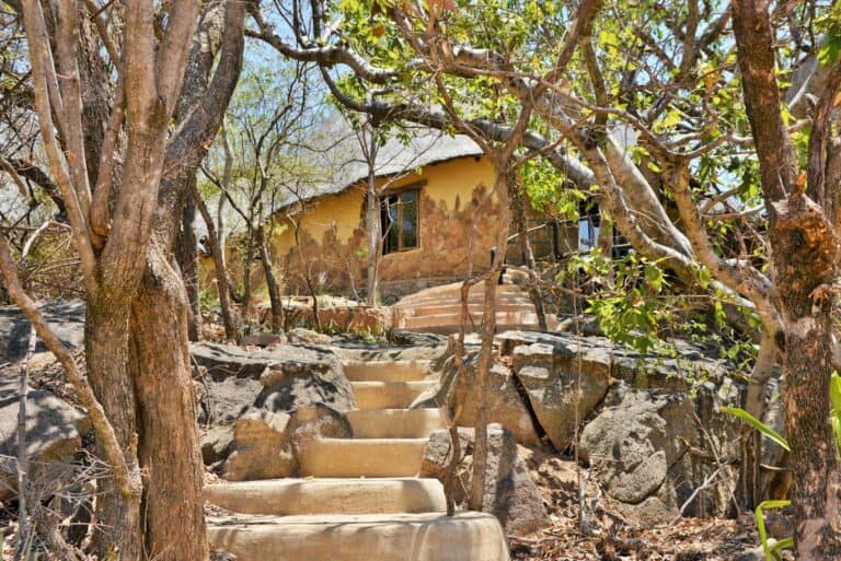 View of the homestead suite from the granite boulder staircase at Amalinda Lodge, Zimbabwe.