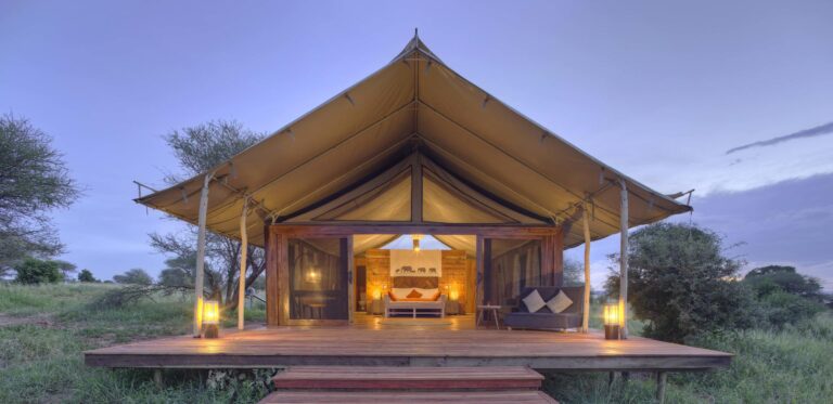 Outside view of Ndovu Tented Lodge at dusk.