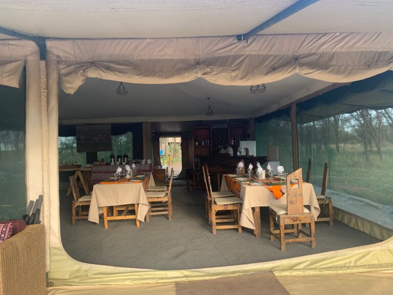 Tables inside a mobile camp at Nasikia Mobile Migration Camp, Tanzania.
