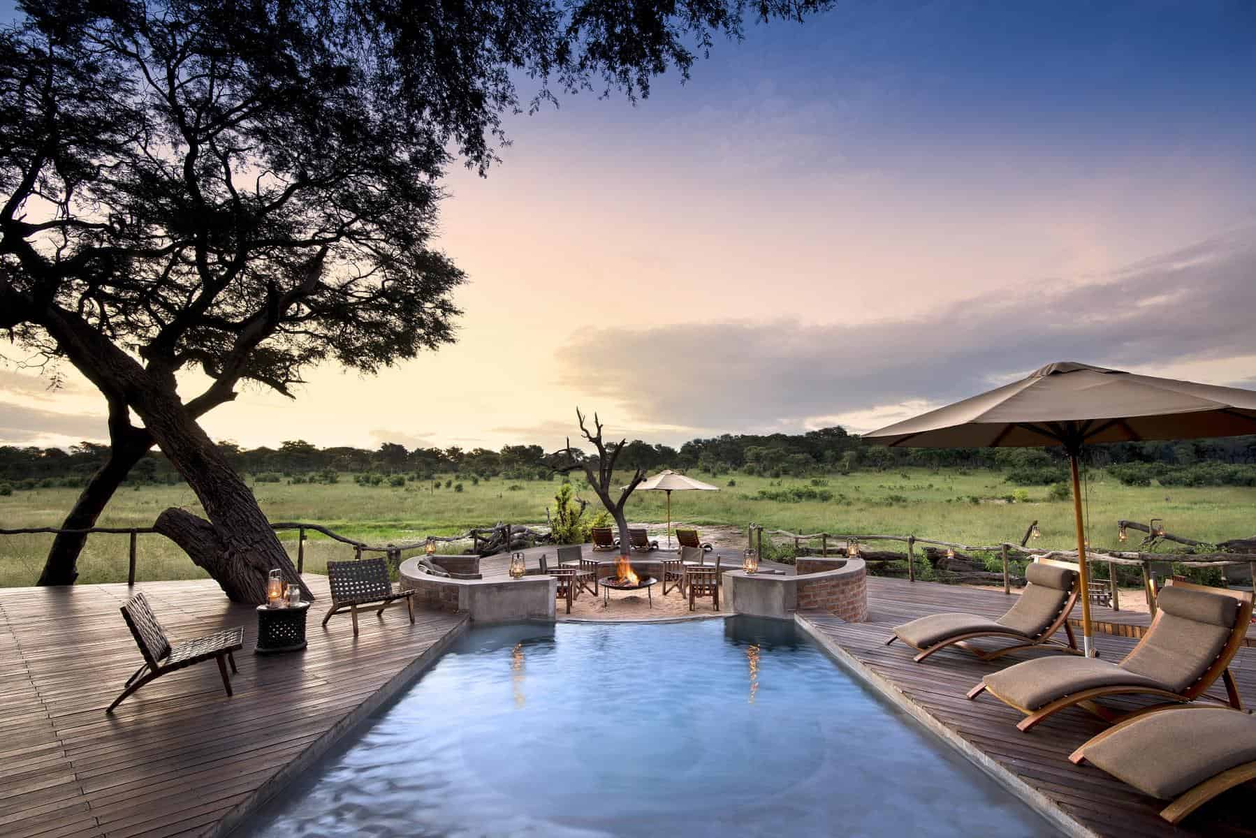 View of the boma from the pool at Somalisa Acacia Camp, Zimbabwe