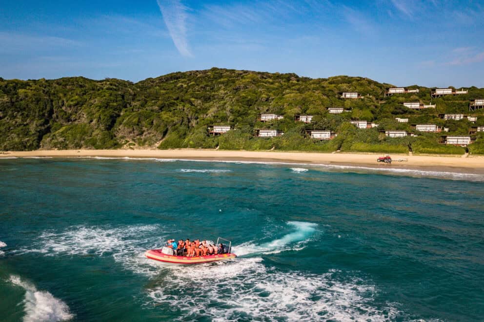 Tourists in a boat on an ocean safari at White Pearl Mozambique.