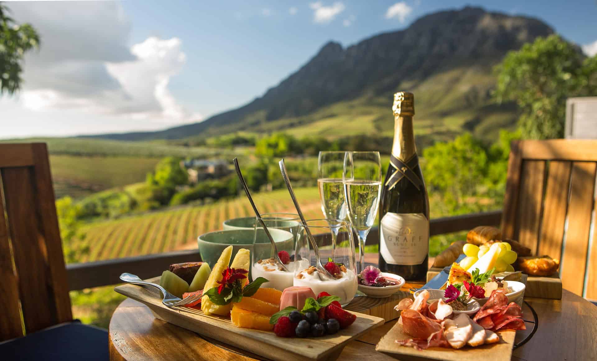 A table setting overlooking the winelands at Delaire Graff Lodges & Spa, South Africa.