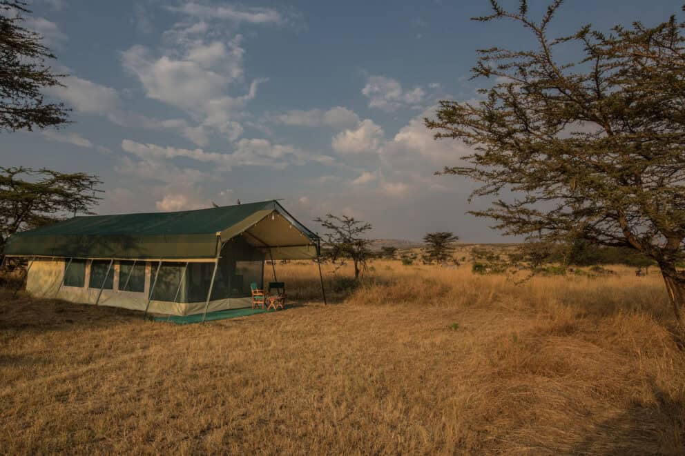 Exterior view of a tented suite on the open plains at Nasikia Mobile Migration Camp, Tanzania.