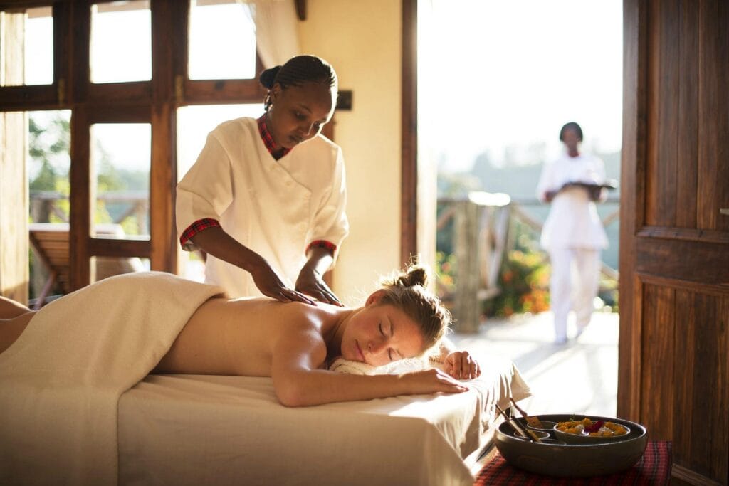 A woman getting a back massage in a spa
