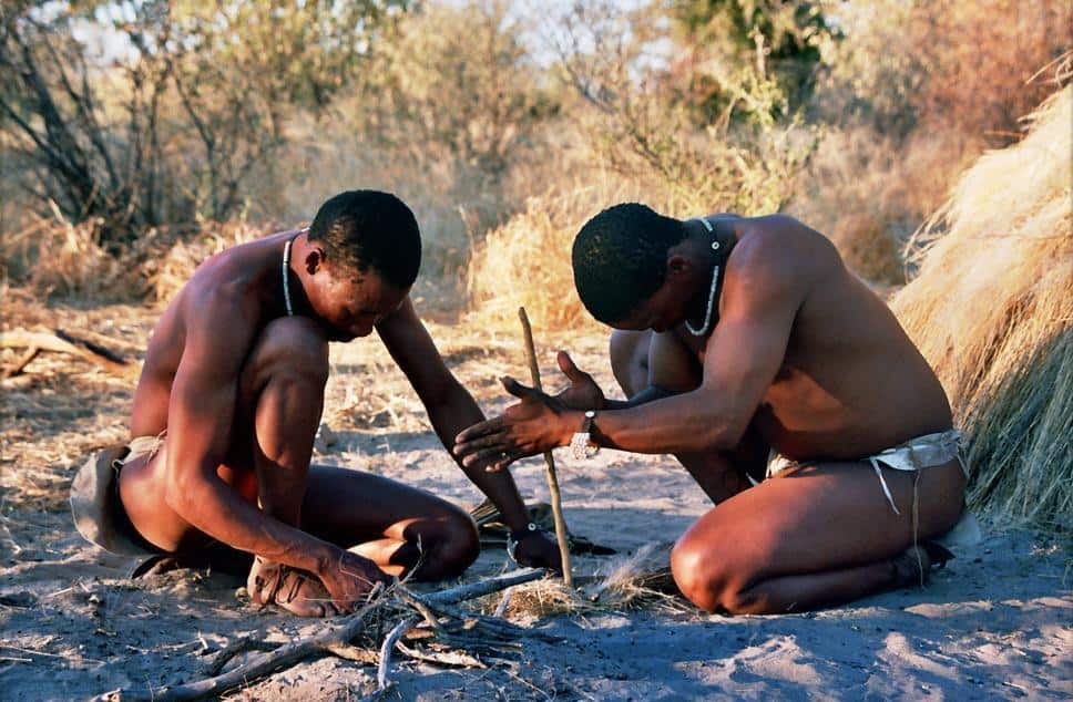 San men demonstrate traditional techniques to start fire, Botswana.