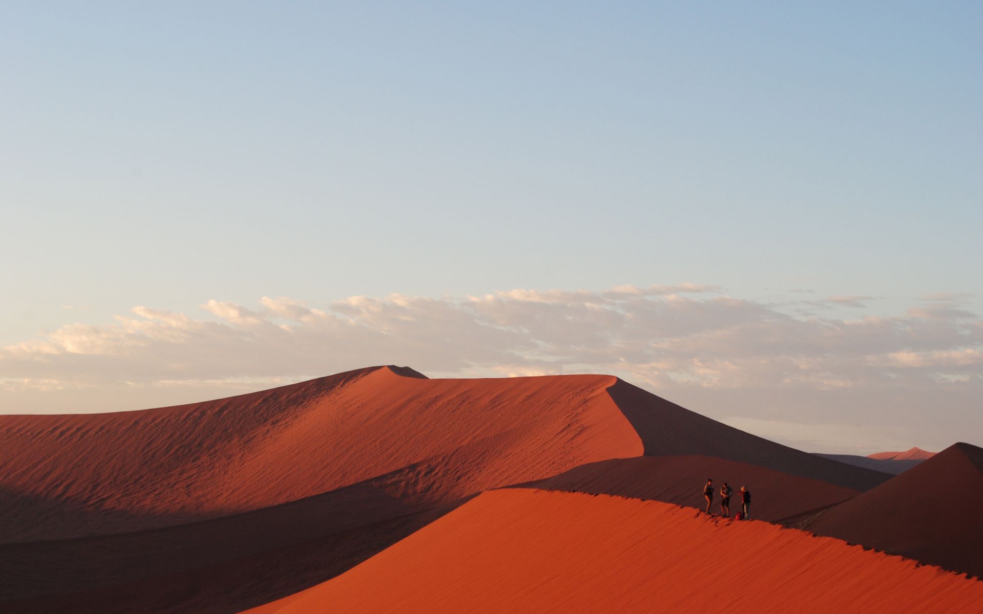 Hikers on a dune in Namibia