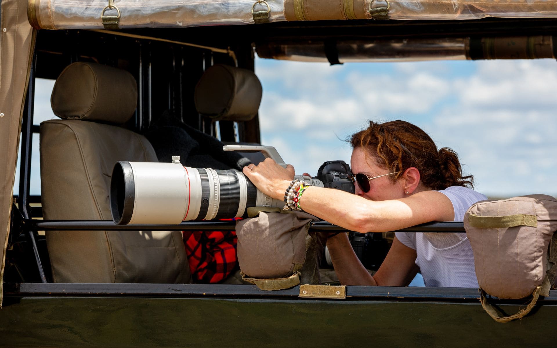 woman on photographic safari taking pictures