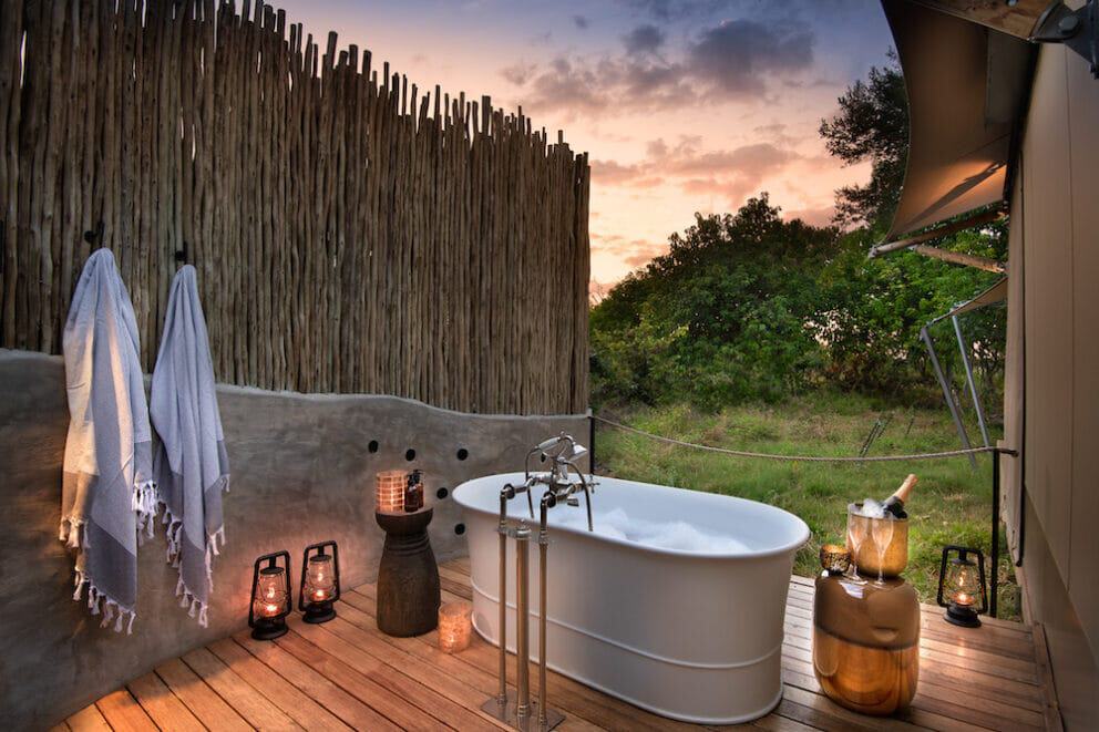 Outside bathtub with African bush view