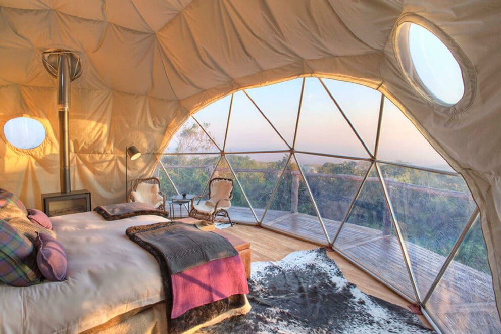 Dome tent bedroom with fireplace overlooking the wilderness of Tanzania