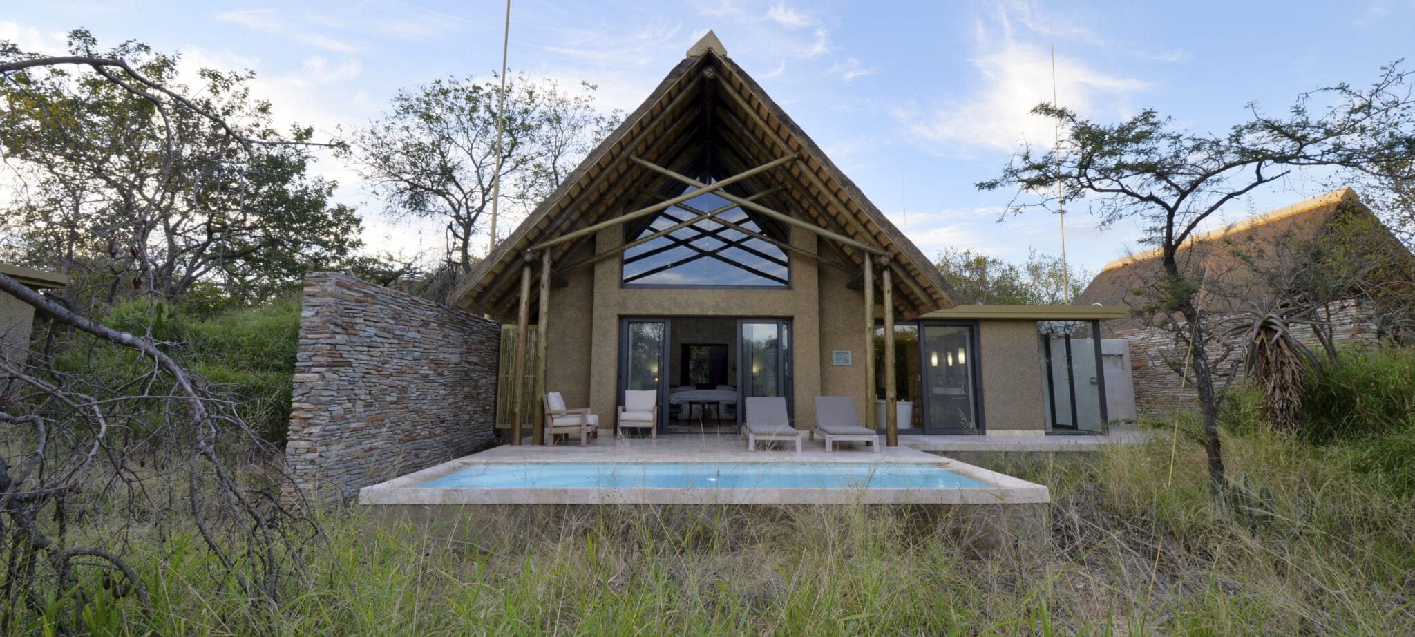 View of a luxury suite from the bush at Kapama Southern Camp