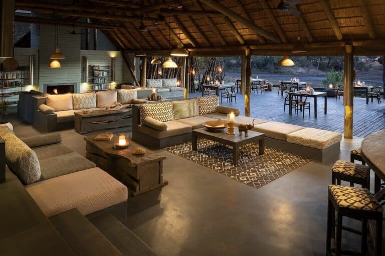 View of the deck area from the candle lit lounge at Simbavati River Lodge, South Africa.