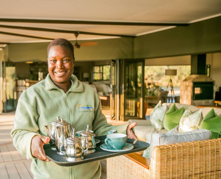 Lodge staff serving tea at Old Drift Lodge.