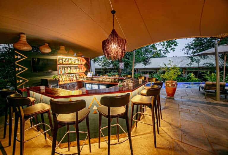 View of the bar area, overlooking the African bush at Shongwe Lookout, Zimbabwe.