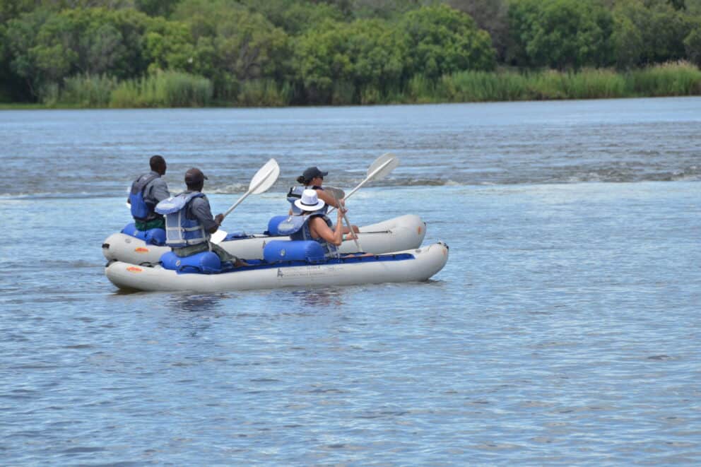 Tourists canoeing on the Zambezi River at Chundu Island, Zimbabwe.