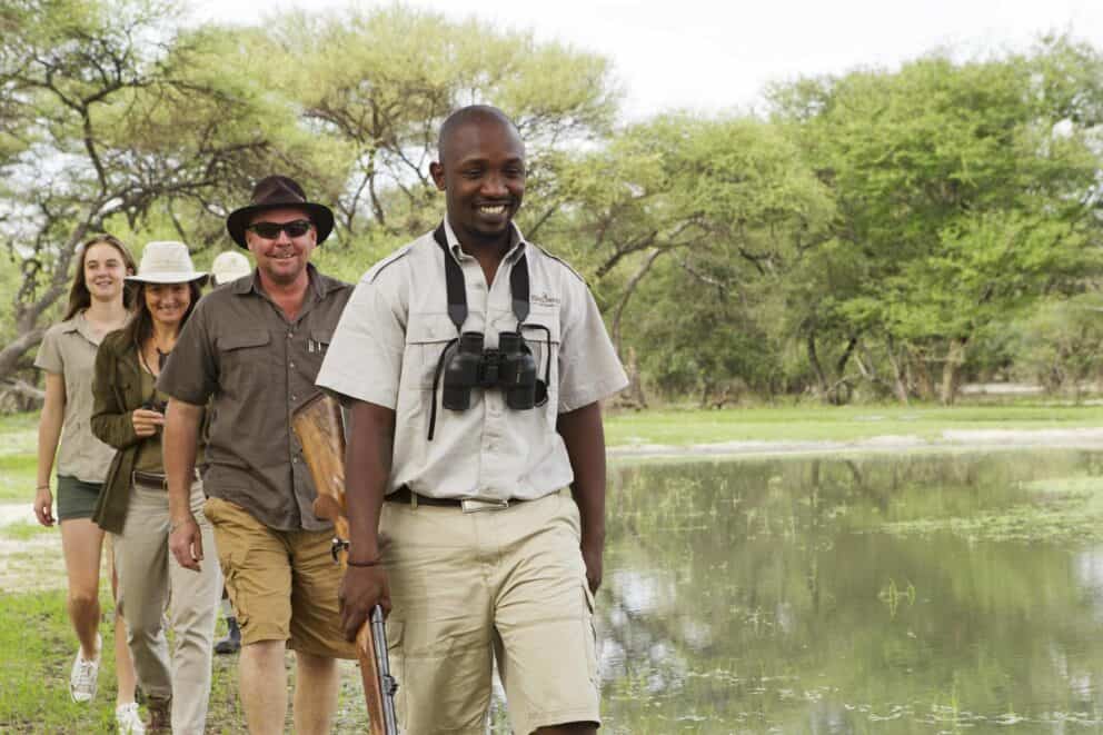 A family on a guided walking safari at Shinde Footsteps, Botswana.