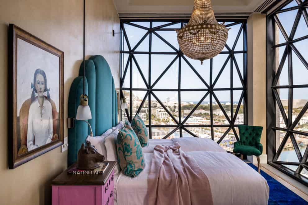 View of the Royal Suite bedroom offering panoramic views over the Atlantic Ocean at The Silo Hotel, South Africa.