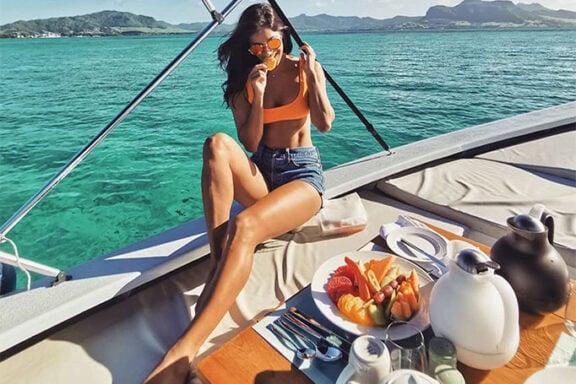 Woman on a boat in Mauritius on an African beach holiday