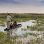 A couples mokoro ride in Linyanti. A great activity for a Botswana honeymoon safari.