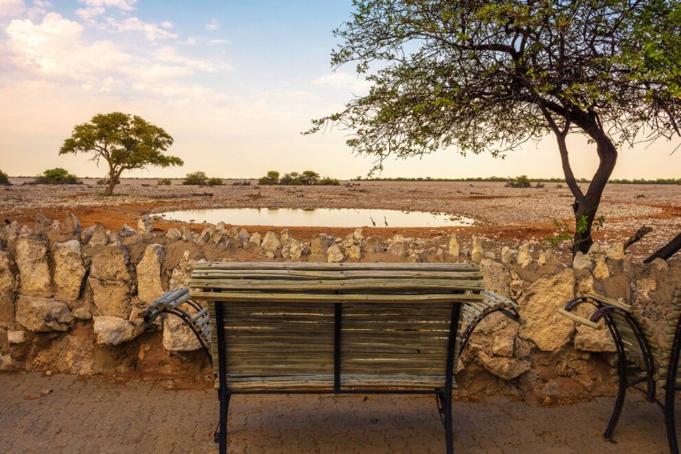 Bench at the waterhole of Okaukuejo Campsite, Namibia.