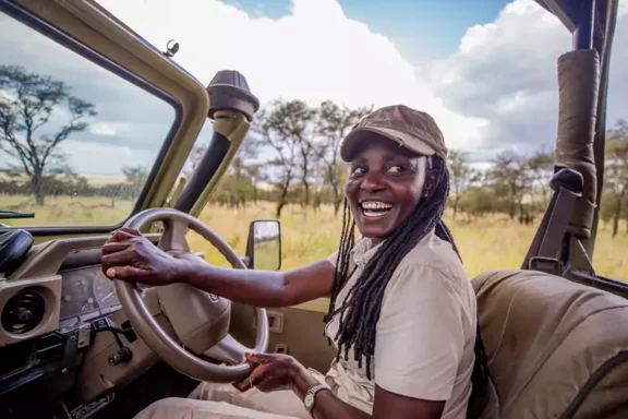 Safari guide Zawadi drives out of Dunia Camp, Tanzania | Photo credit: Asilia Africa