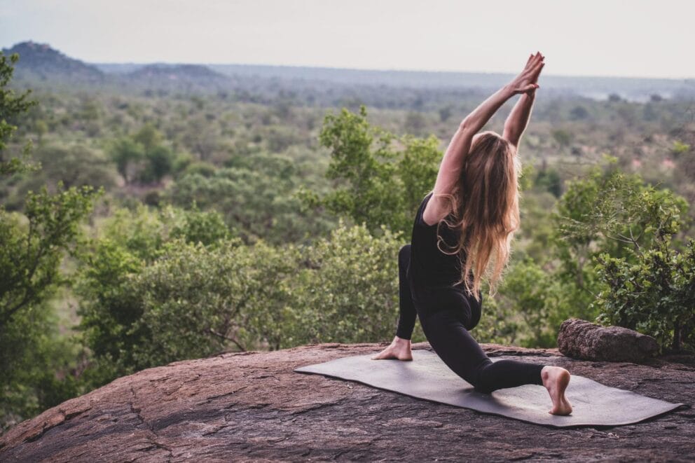 A guest doing yoga at Londolozi Healing House at Varty Camp.