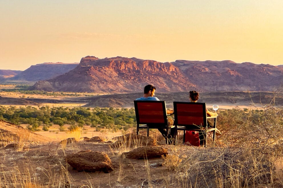 Couple having sundowners at Twyfelfontein Adventure Camp