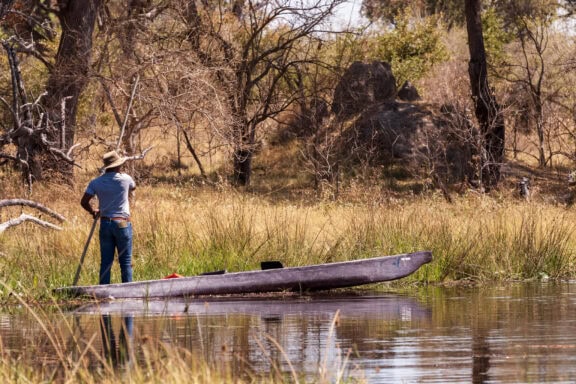 Mokoro on a river | Photo credits: Feline Fields Vintage Camp
