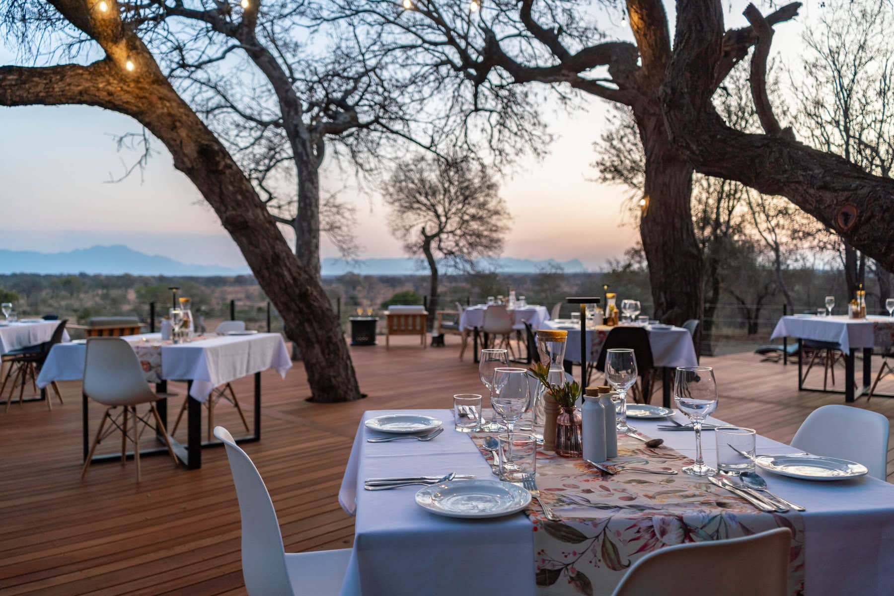 Dining on the deck overlooking Balule Game Reserve at sunset