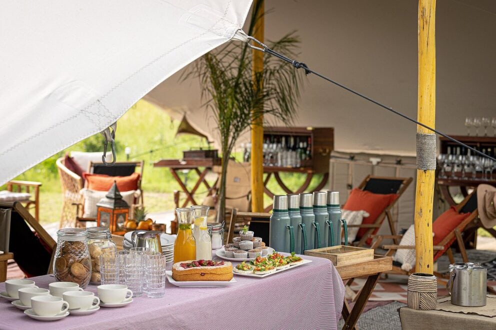 Breakfast table under tent | Photo credit: Feline Fields Vintage Camp