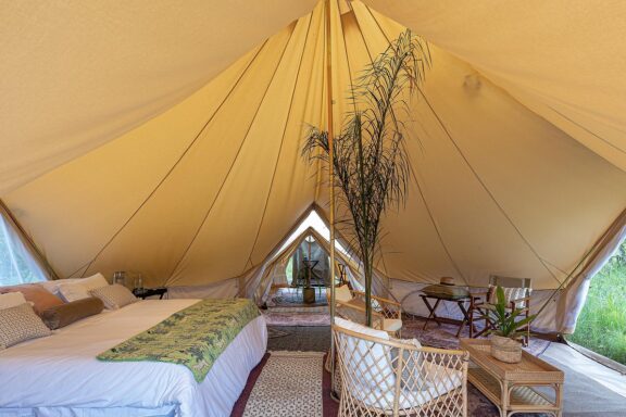 Bedroom in tent | Photo credit: Feline Fields Vintage Camp