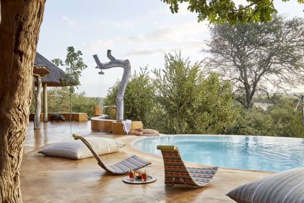 View of the luxurious pool area at Geiger's Camp in Timbavati Private Nature Reserve.