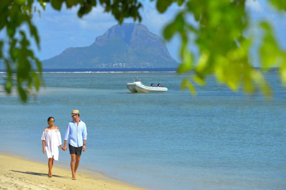 A couple walking on the beach | Photo credit: Sofitel Mauritius L'Impérial Resort & Spa