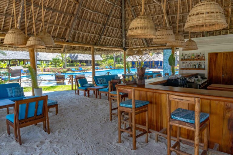 View of the bar seating area with the beach sand as the floor at Breezes Beach Club and Spa, Zanzibar.